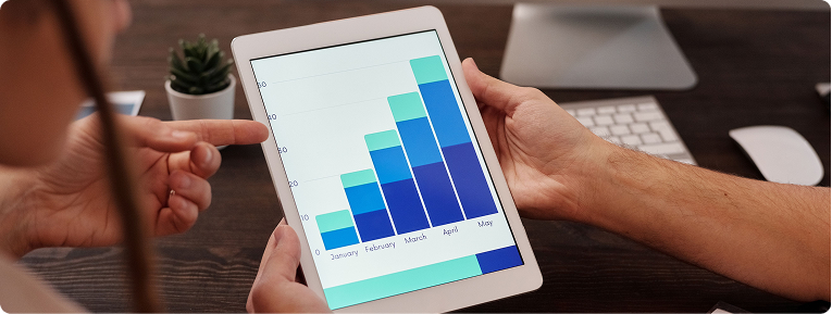 A rising bar chart shown on a tablet
